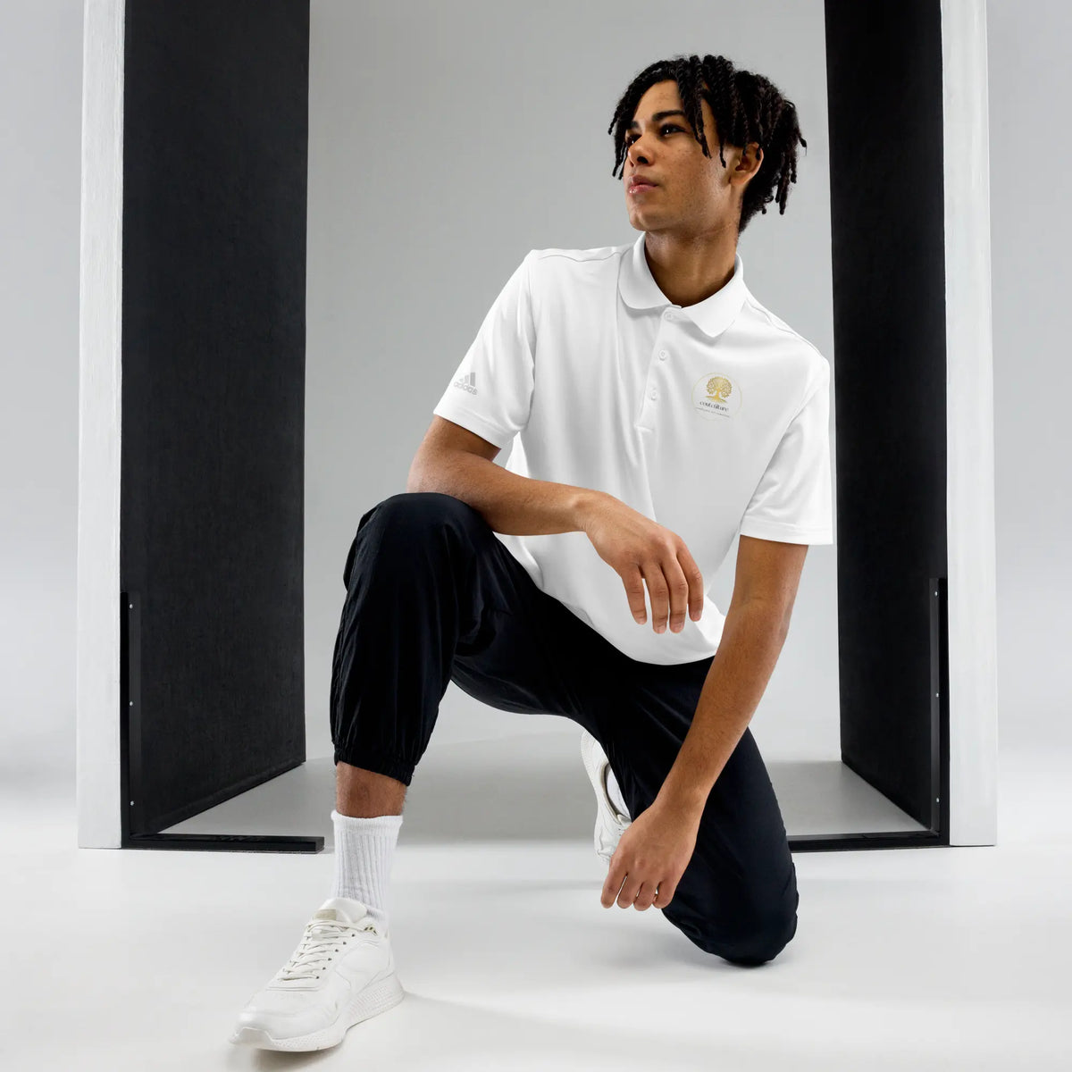 White adidas® performance polo shirt with embroidered CoutCülture emblem on chest, front view.