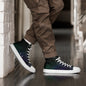 High-top canvas shoes with aurora borealis gradient design in green, blue, and purple